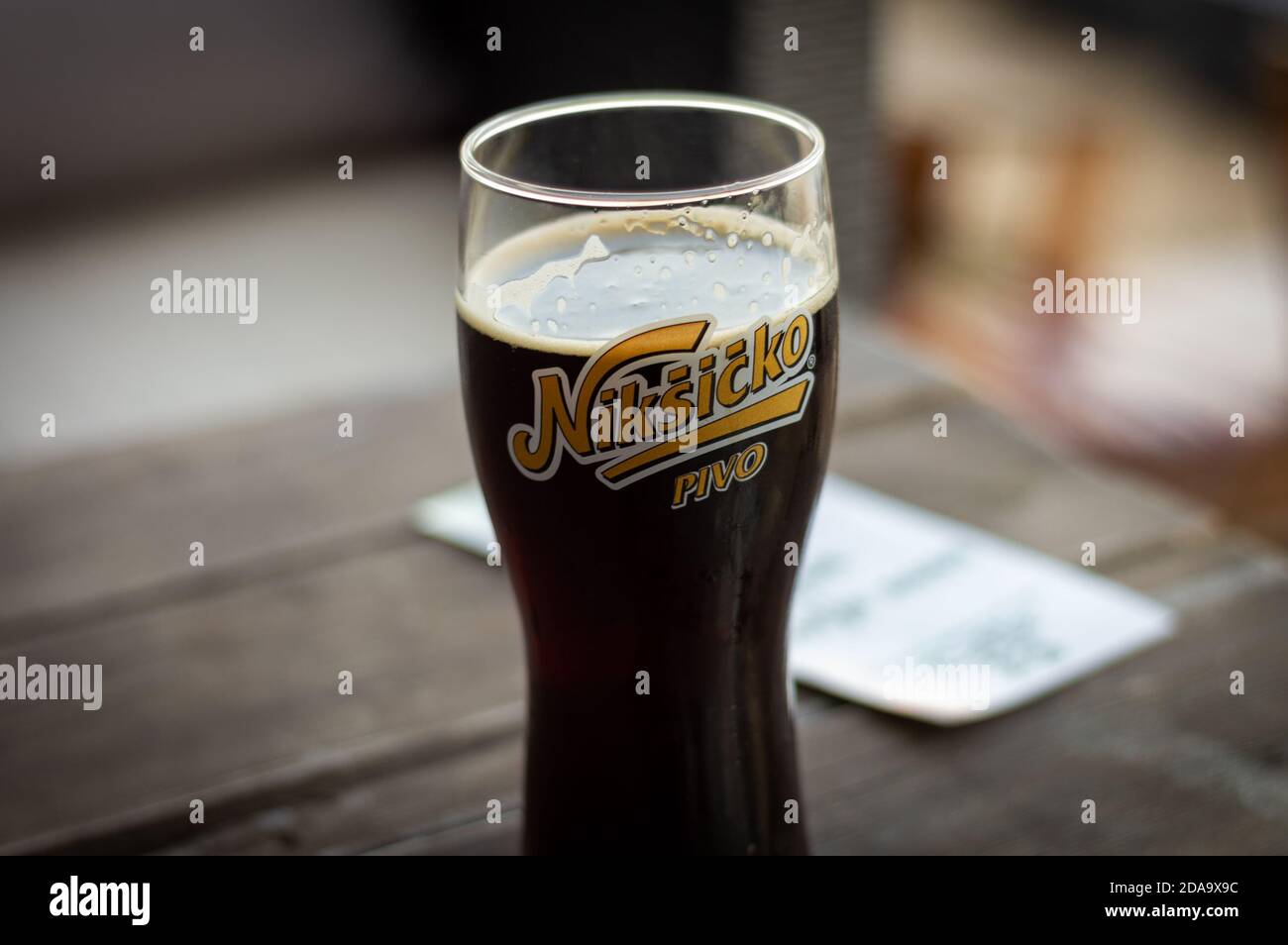 Belgrade / Serbia - May 13, 2015: A glass of cold Niksic Dark Beer, served in a restaurant in Belgrade, Serbia Stock Photo