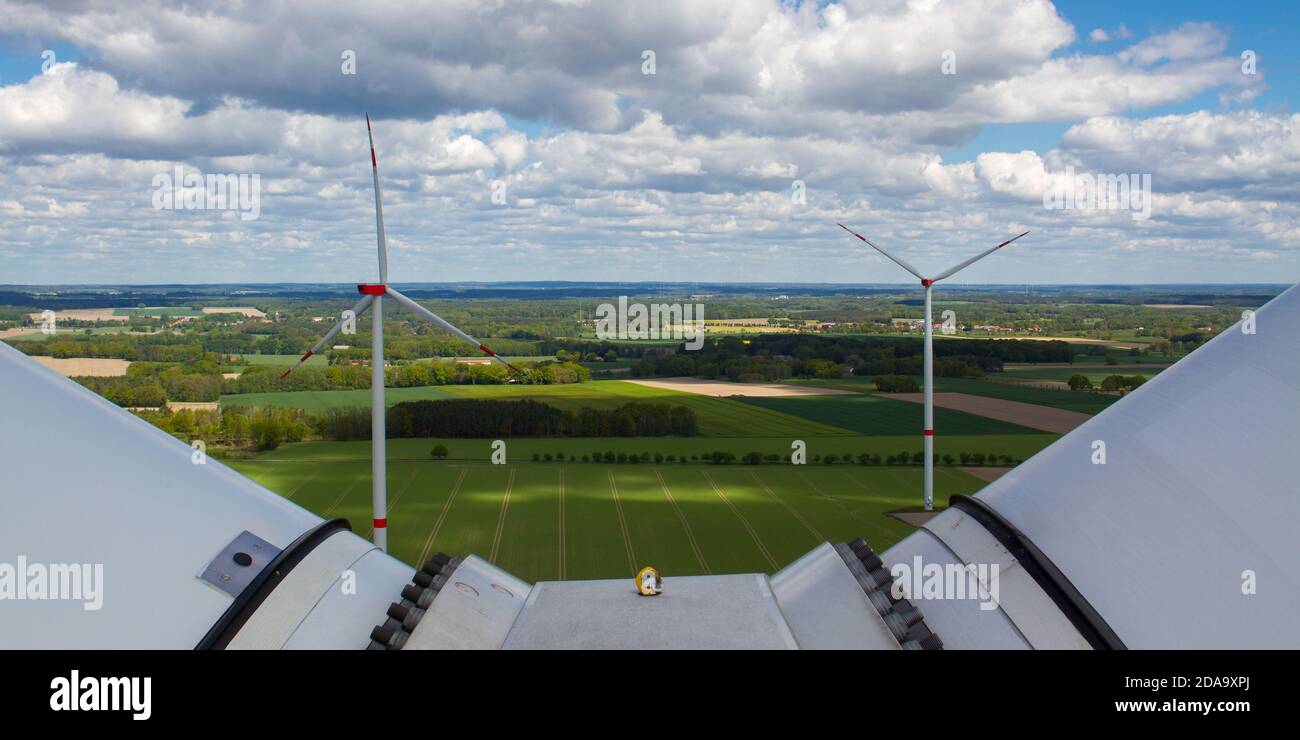 wind turbine, wind farm on a sunny cloudy day shot from eye level, hub