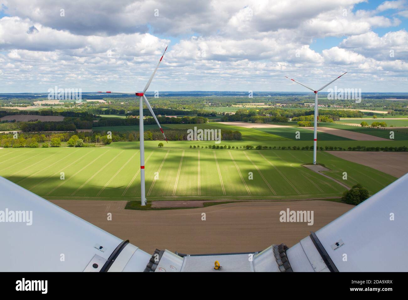 wind turbine, wind farm on a sunny cloudy day shot from eye level, hub