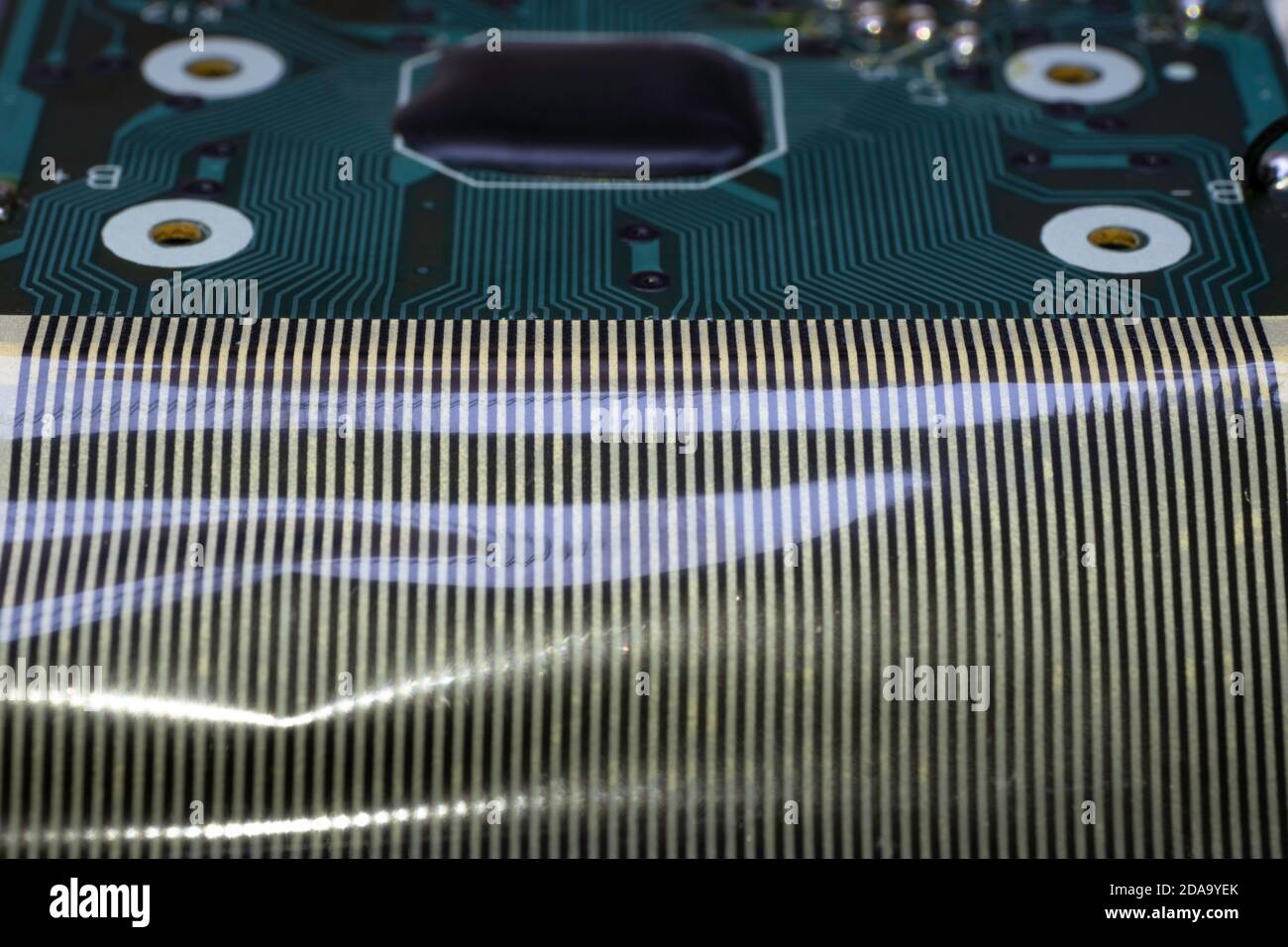 Electronic circuit board of an electronical calculator with many electrical components Stock Photo