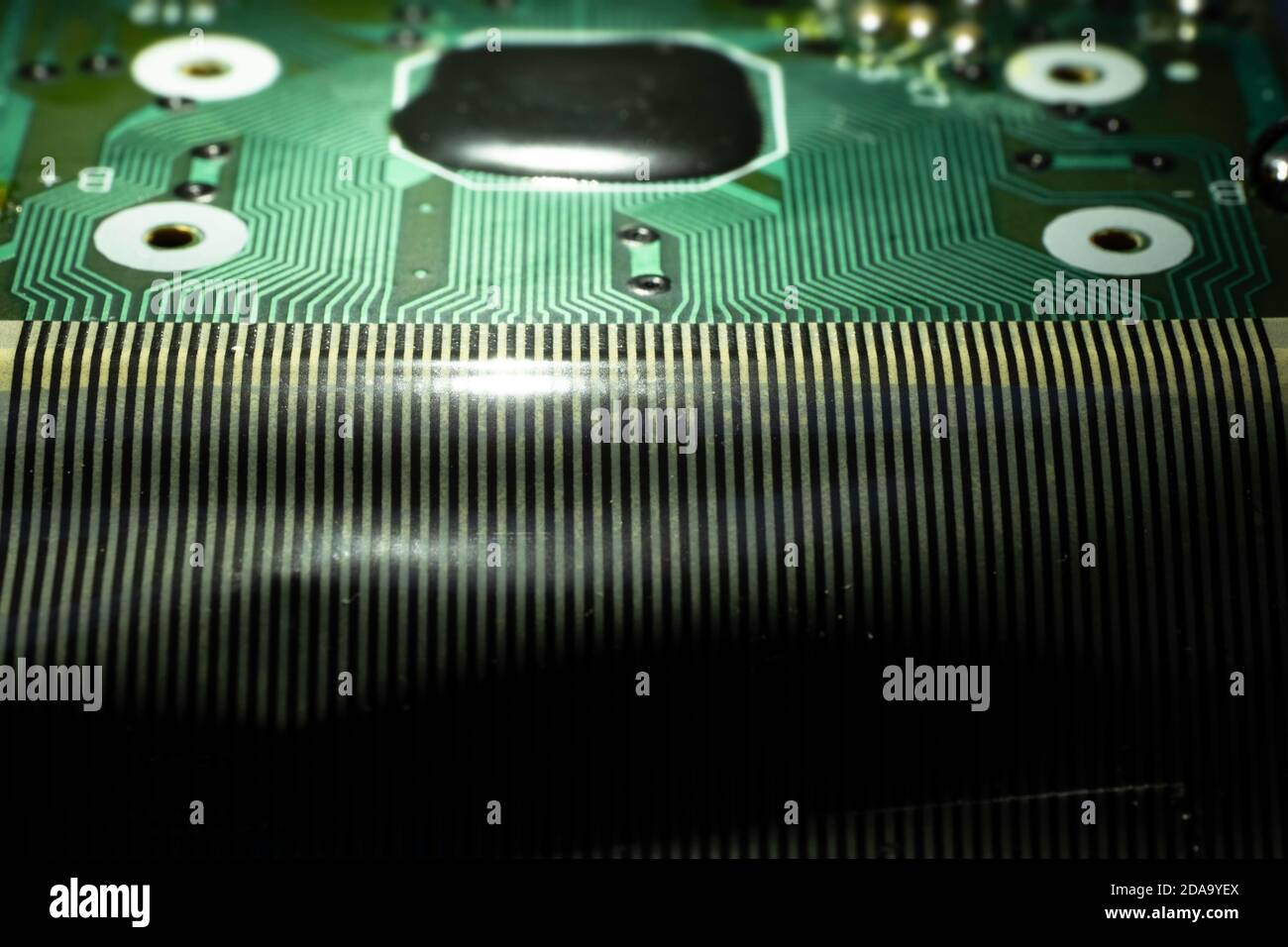 Electronic circuit board of an electronical calculator with many electrical components Stock Photo