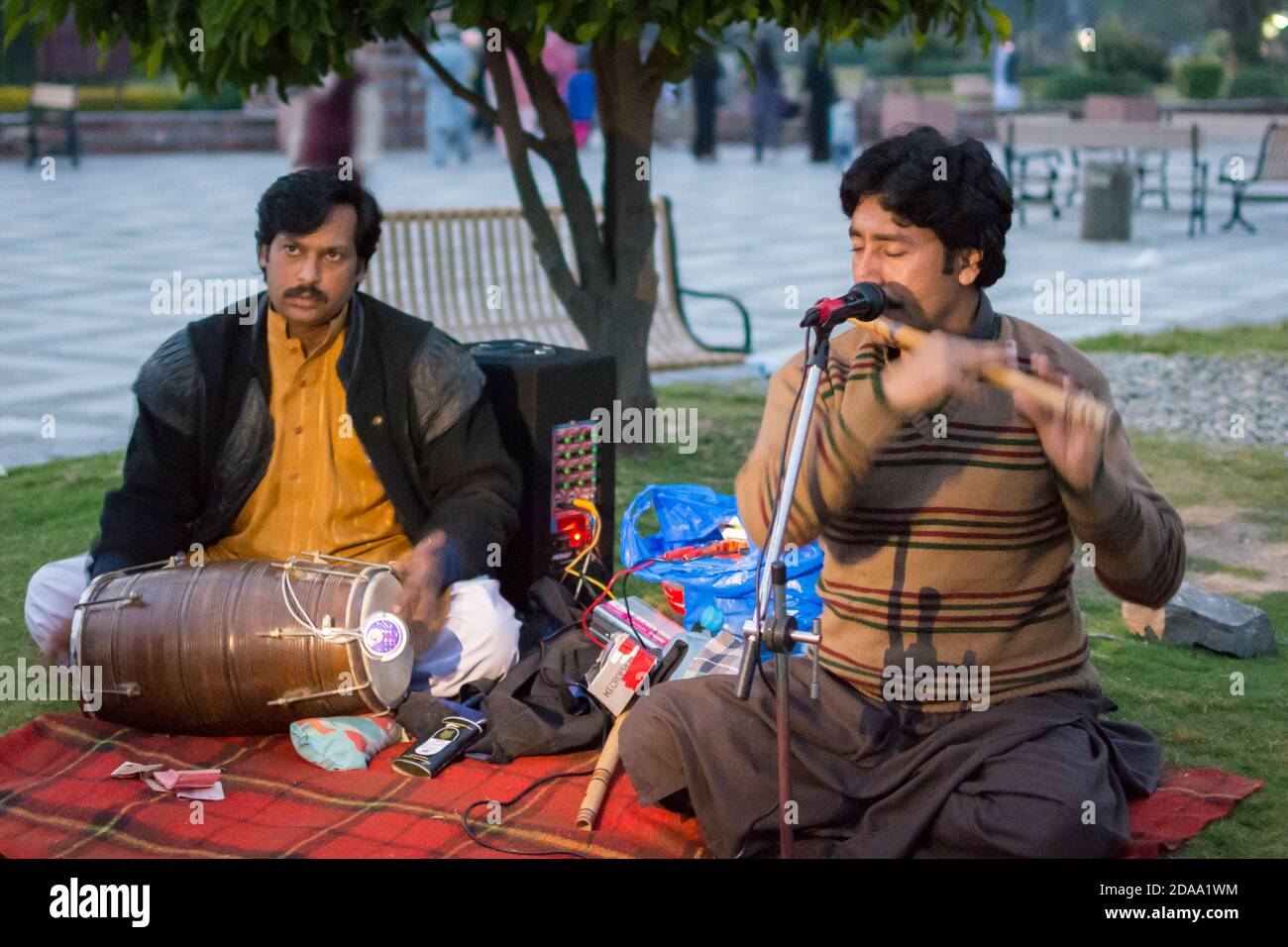Islamabad / Pakistan - November 2, 2015: Street performers playing traditional Pakistan music in Lake View Park, next to Rawal Lake. Stock Photo