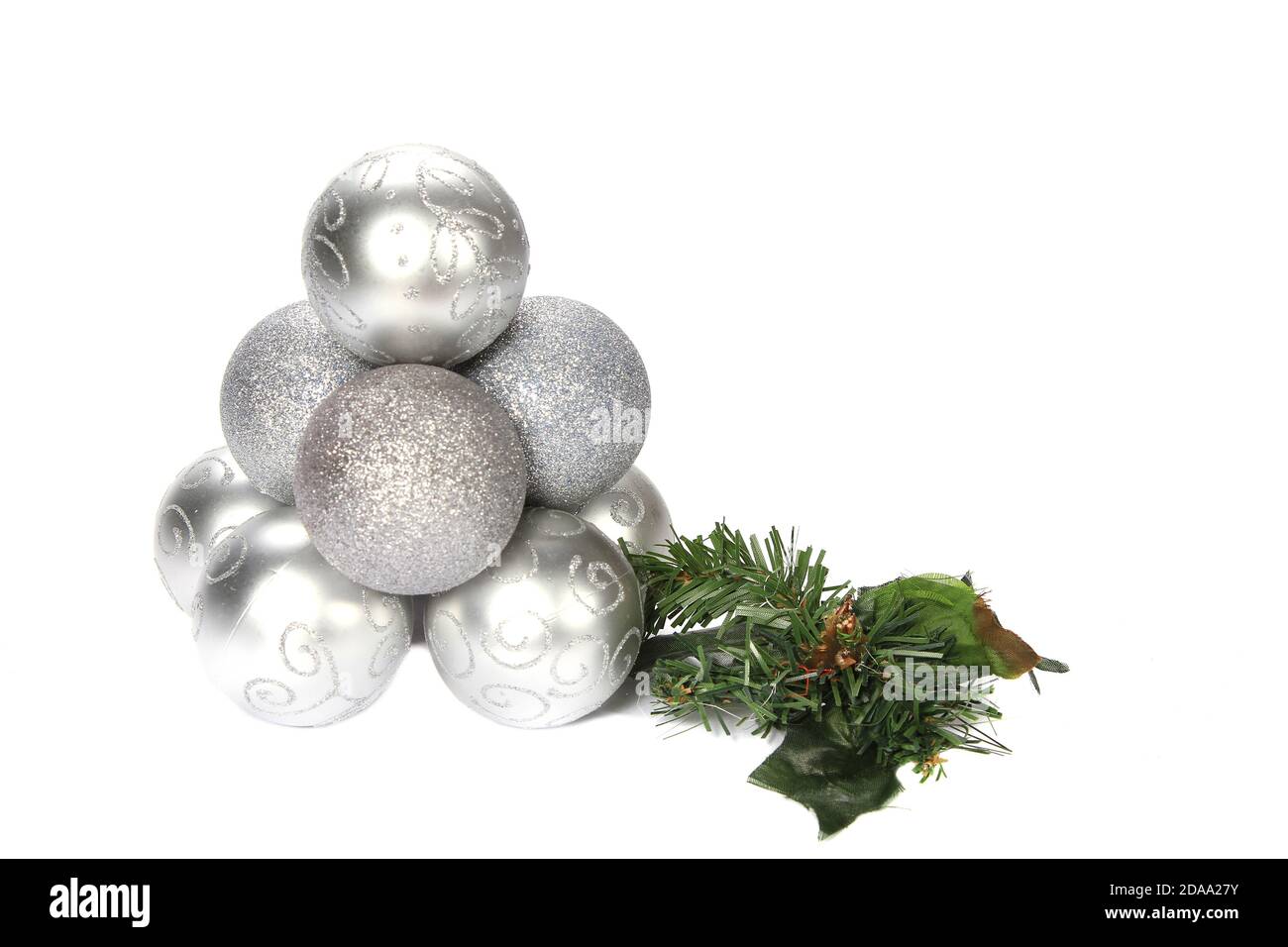 Pile of silver Christmas decorations isolated on a white background ...