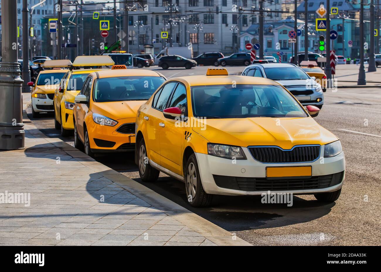 Lots of Yellow Taxis in the City centre Parking lot Stock Photo