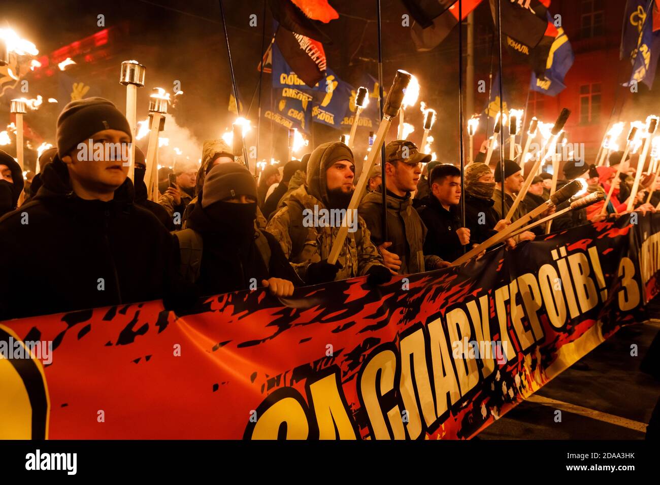 KIEV, UKRAINE - Jan. 01, 2018: Ukrainian nationalist activists mark the 109th birth anniversary of Stepan Bandera. Words on the poster - For the glory of heroes Stock Photo