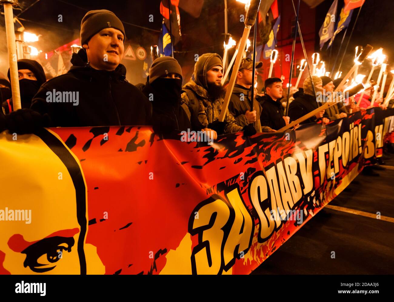 KIEV, UKRAINE - Jan. 01, 2018: Ukrainian nationalist activists mark the 109th birth anniversary of Stepan Bandera. Words on the poster - For the glory of heroes Stock Photo
