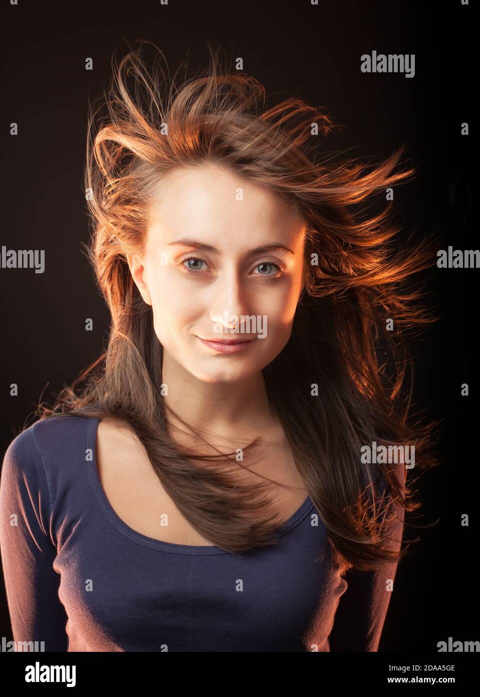 Portrait of a beautiful young woman on a dark background Stock Photo ...