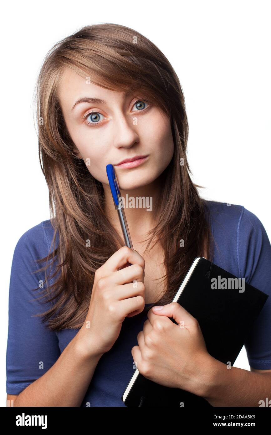 student with a pen and a notebook on a white background Stock Photo - Alamy