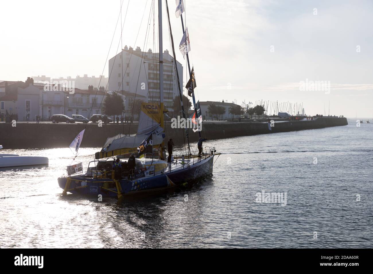 LES SABLES D'OLONNE, FRANCE - NOVEMBER 08, 2020: Manuel Cousin boat (Groupe Setin) in the channel for the start of the Vendee Globe 2020 Stock Photo