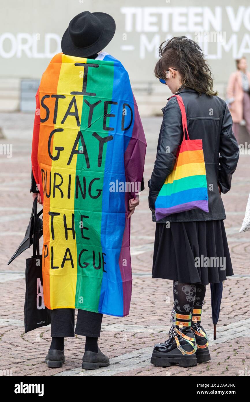 I stayed gay during the plague. Writing on a rainbow flag. Helsinki Pride 2020. Stock Photo