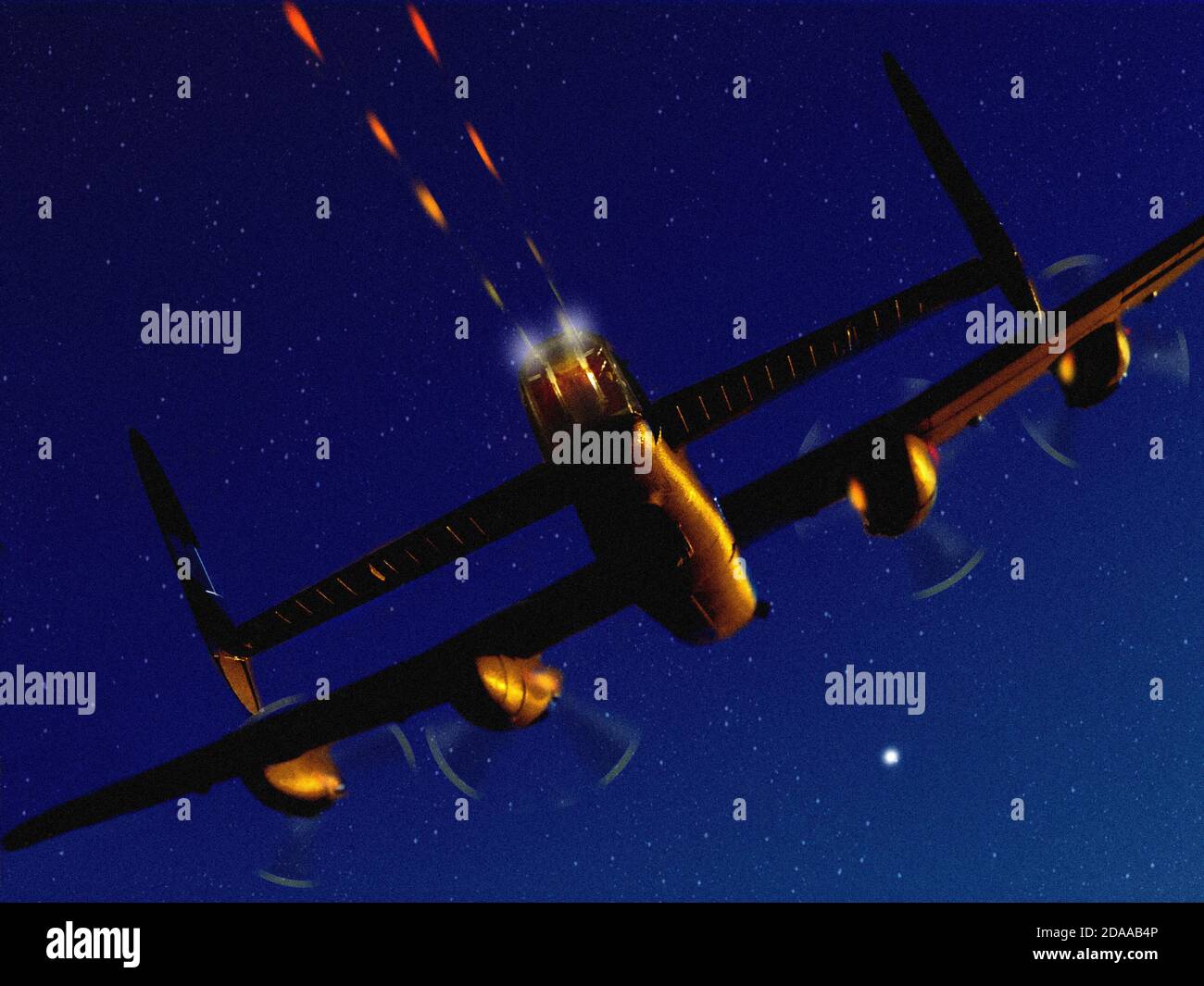 'Tail end Charlie' A rear end, night time scene of a World War Two Avro Lancaster aircraft firing its rear guns, using a plastic model and Photoshop. Stock Photo