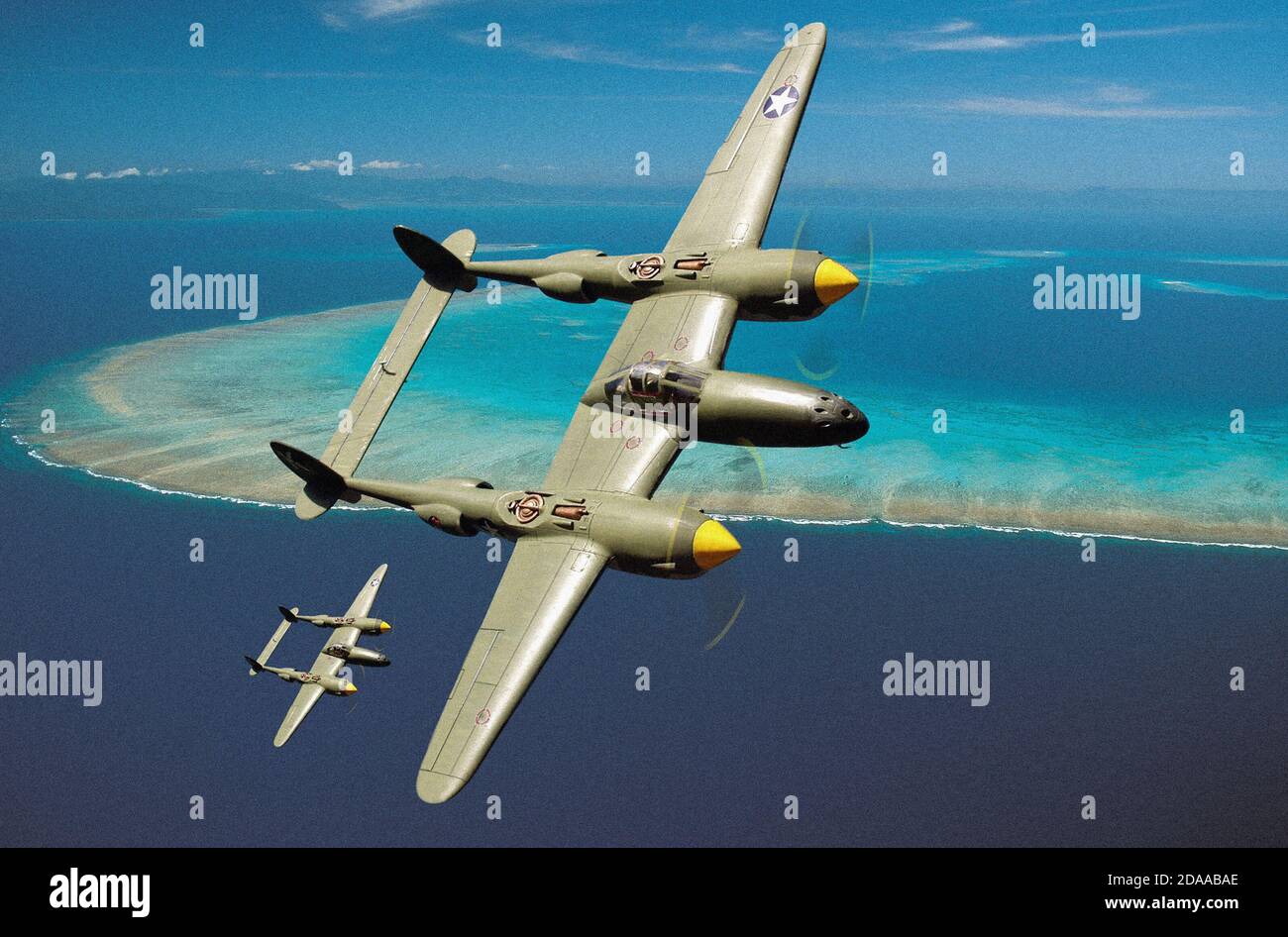 World War Two Lockheed P38 Lightning fighter aircraft over a  Pacific atoll scenario, using plastic models and Photoshop. Stock Photo