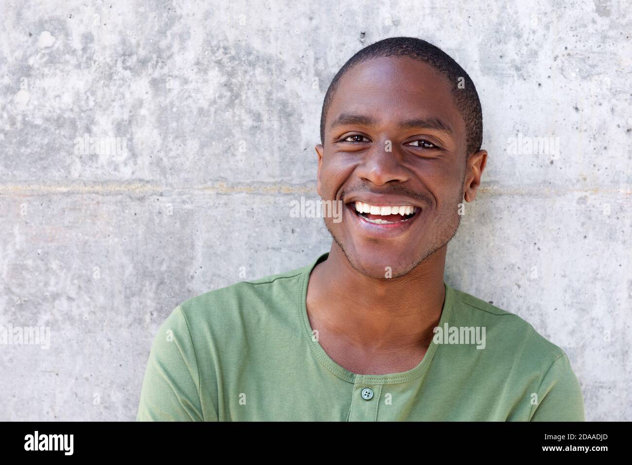 Close up portrait of handsome young african american man smiling Stock Photo