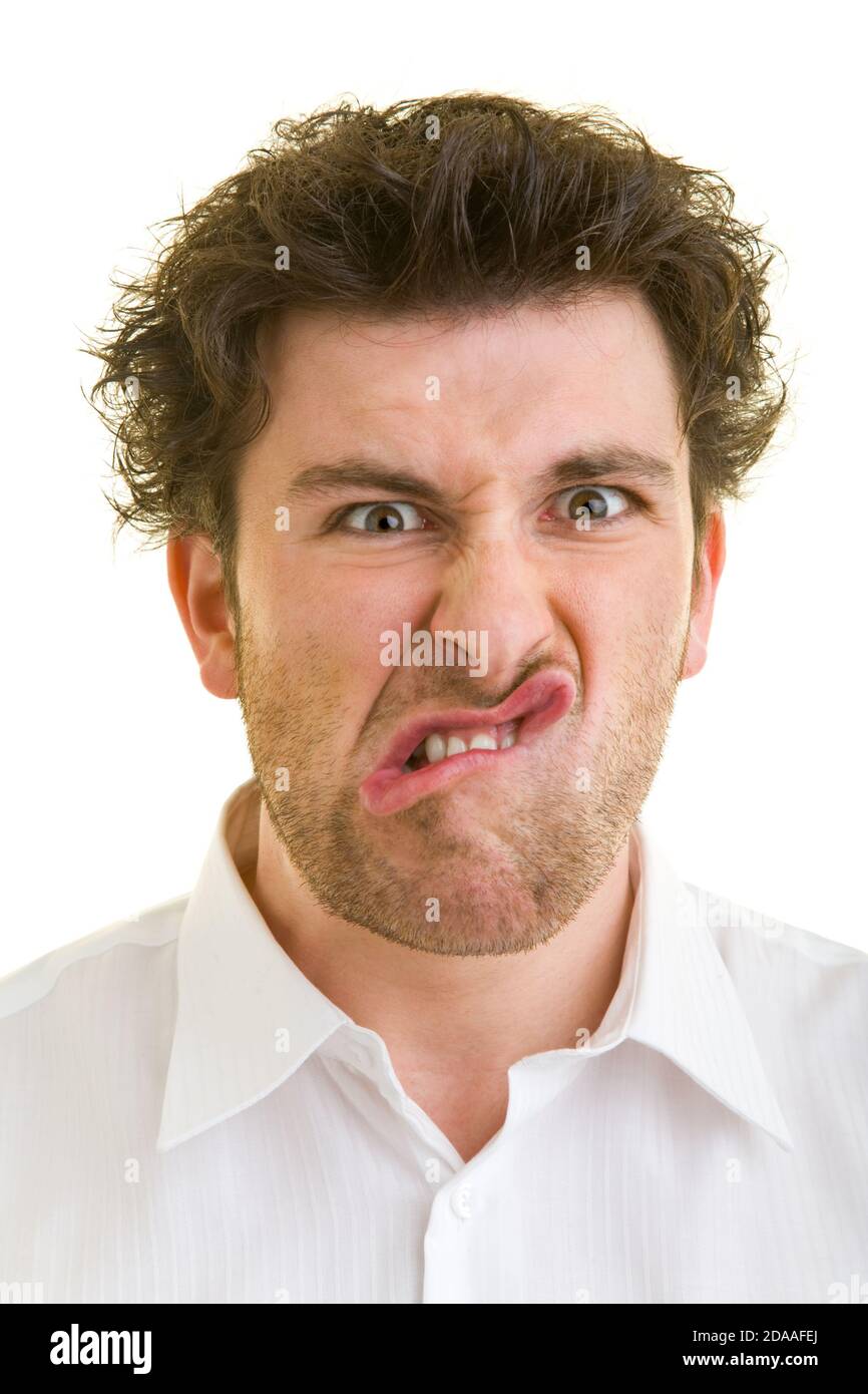 Young man makes a face Stock Photo - Alamy