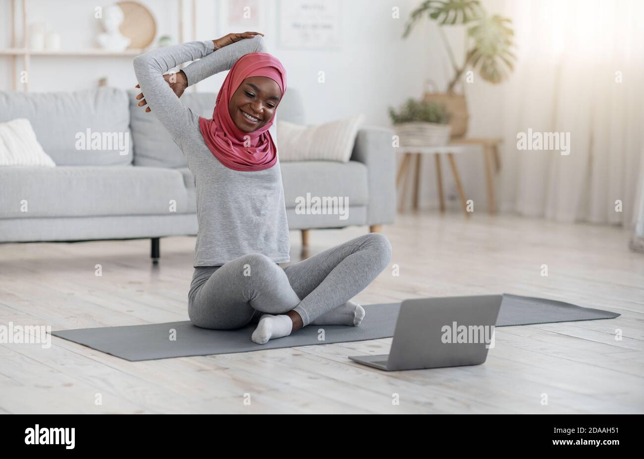 Healthy Lifestyle. Black Muslim Woman Doing Fitness Gymnastics