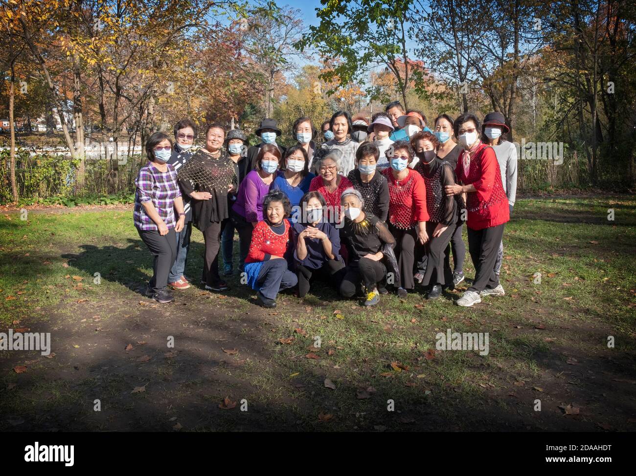 A group photo of middle age & older Korean Americans who meet in Kissena Park for dance exercises classes. Stock Photo