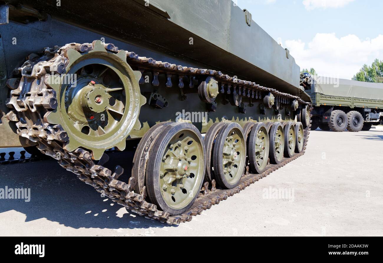 Closeup tracks and wheels of the army tank Stock Photo