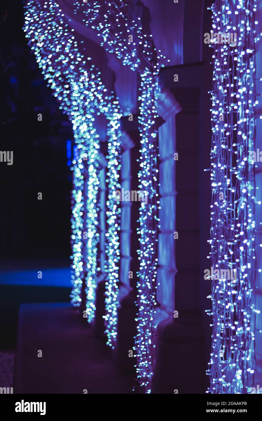 Christmas lights on straight wall hanging, blue Stock Photo