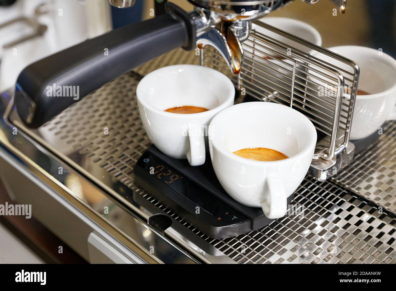 Espresso Machine Pouring Coffee Cups Blurred Background Closeup