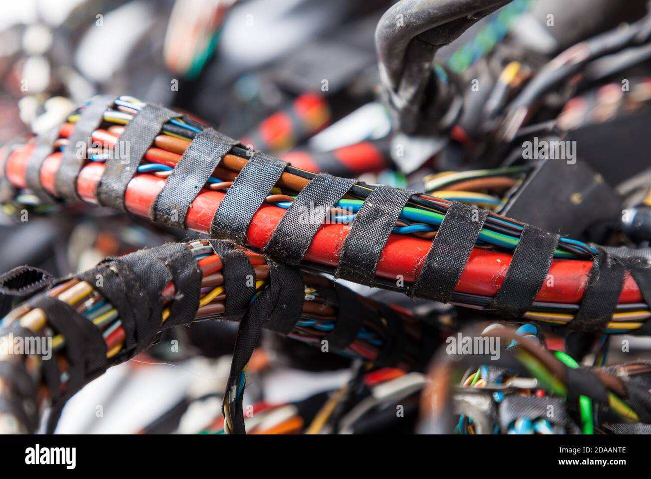 Large wide cable with multicolored orange and green wires, connectors