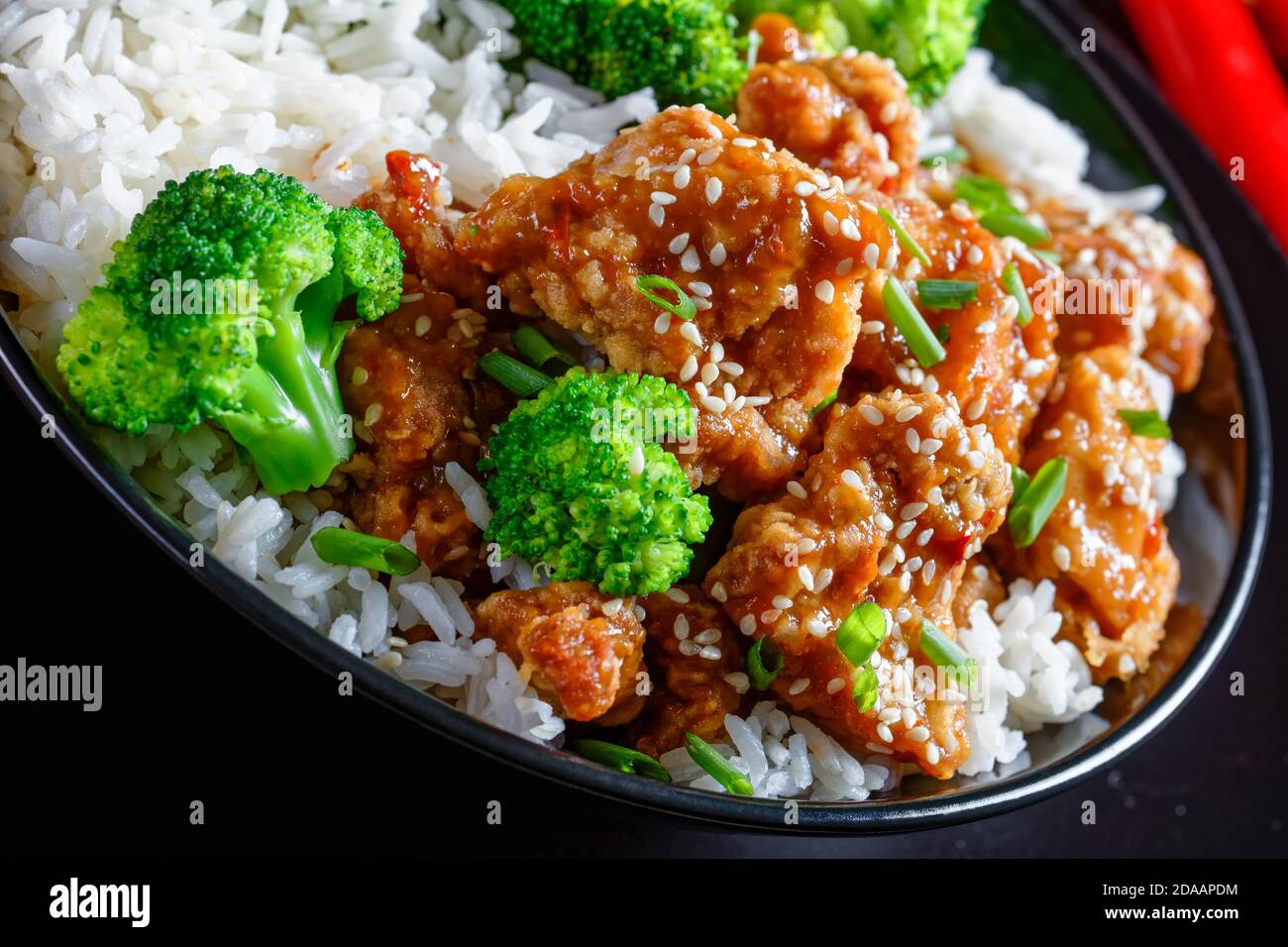 General Tso’s Chicken crispy Chinese chicken bites in a black bowl with