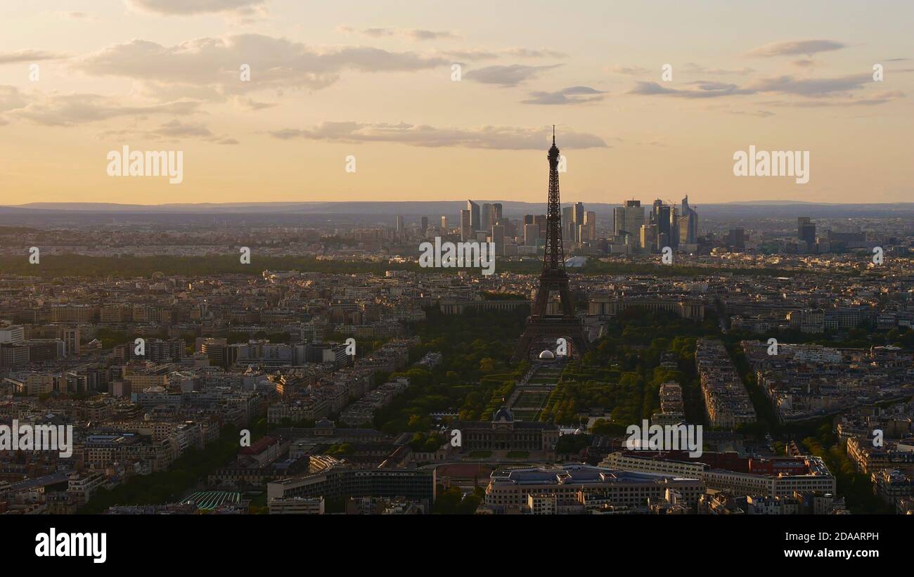 Stunning aerial panoramic view of historic Paris downtown, France with famous Eiffel Tower, park area Champ de Mars and skyscrapers of La Defense. Stock Photo