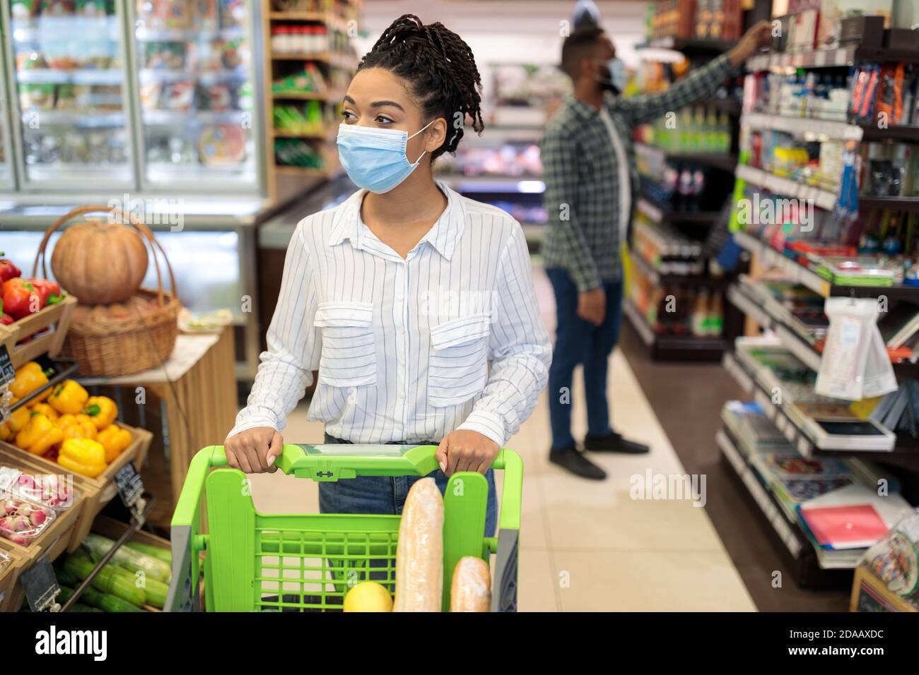 African American Lady In Supermarket Doing Grocery Shopping Buying Food
