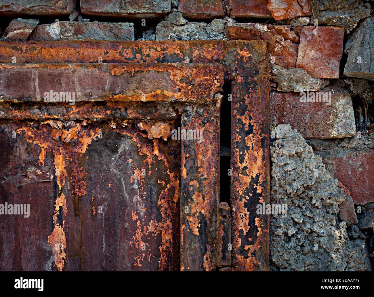 Old rusty door and brick wall Stock Photo