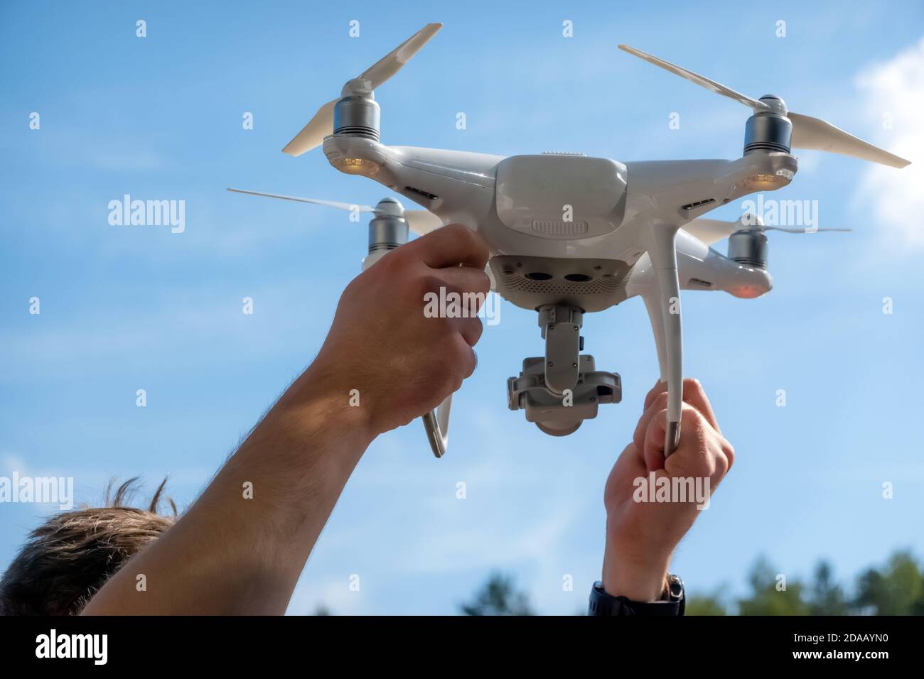 Close up of drone pilot preparing to fly outdoors. Remote controlled