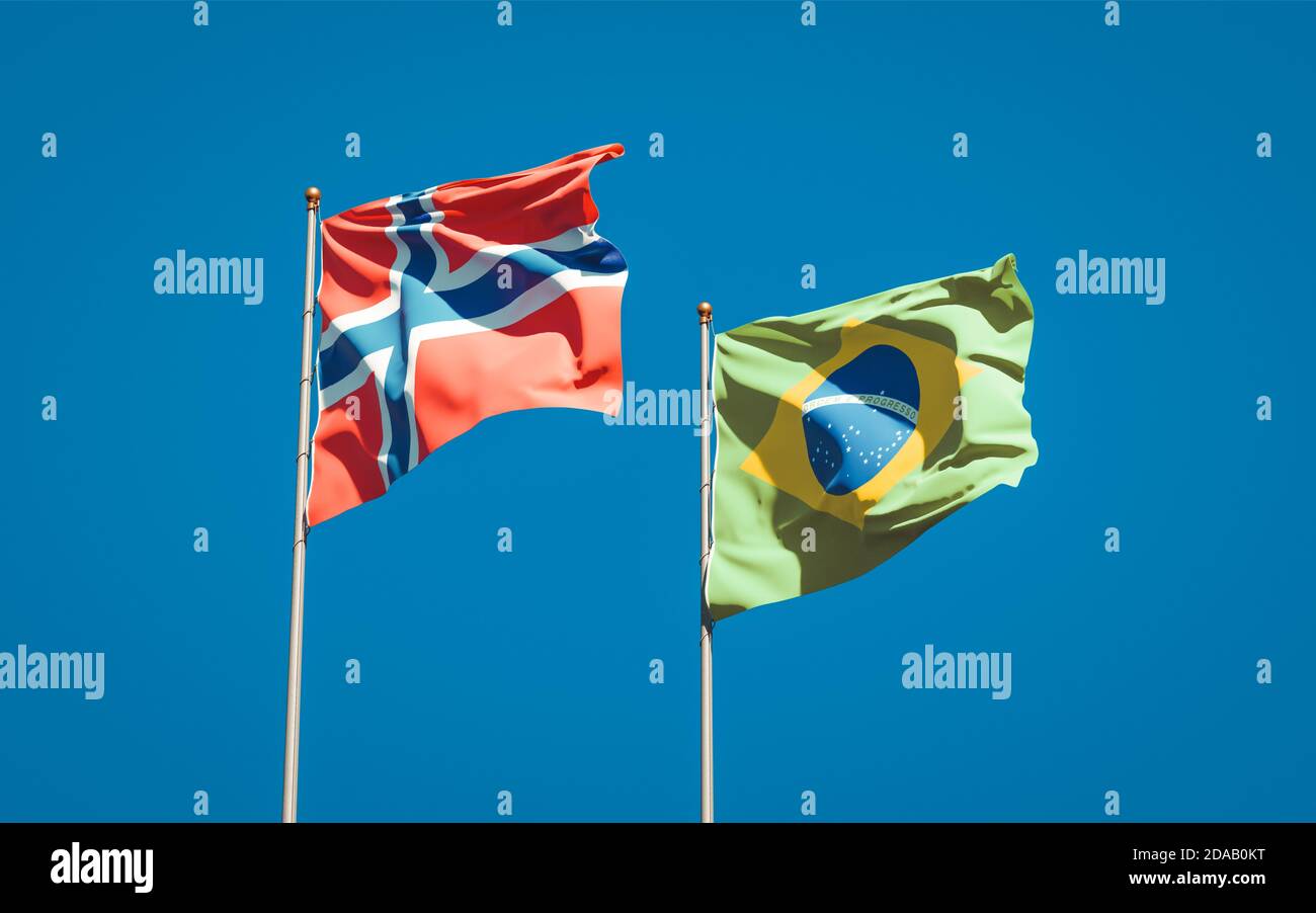 Beautiful national state flags of Norway and Brasil together at the sky ...