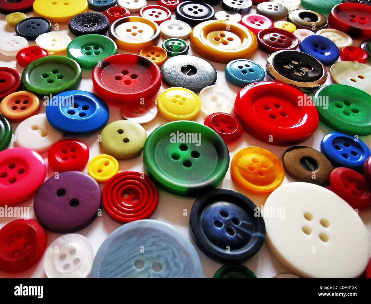 close-up of a great variety of buttons in many colors and sizes, diversity concept Stock Photo