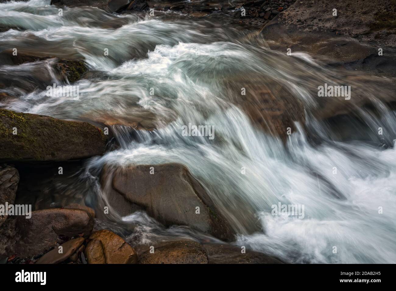 Mountain stream flowing among stones hi-res stock photography and ...