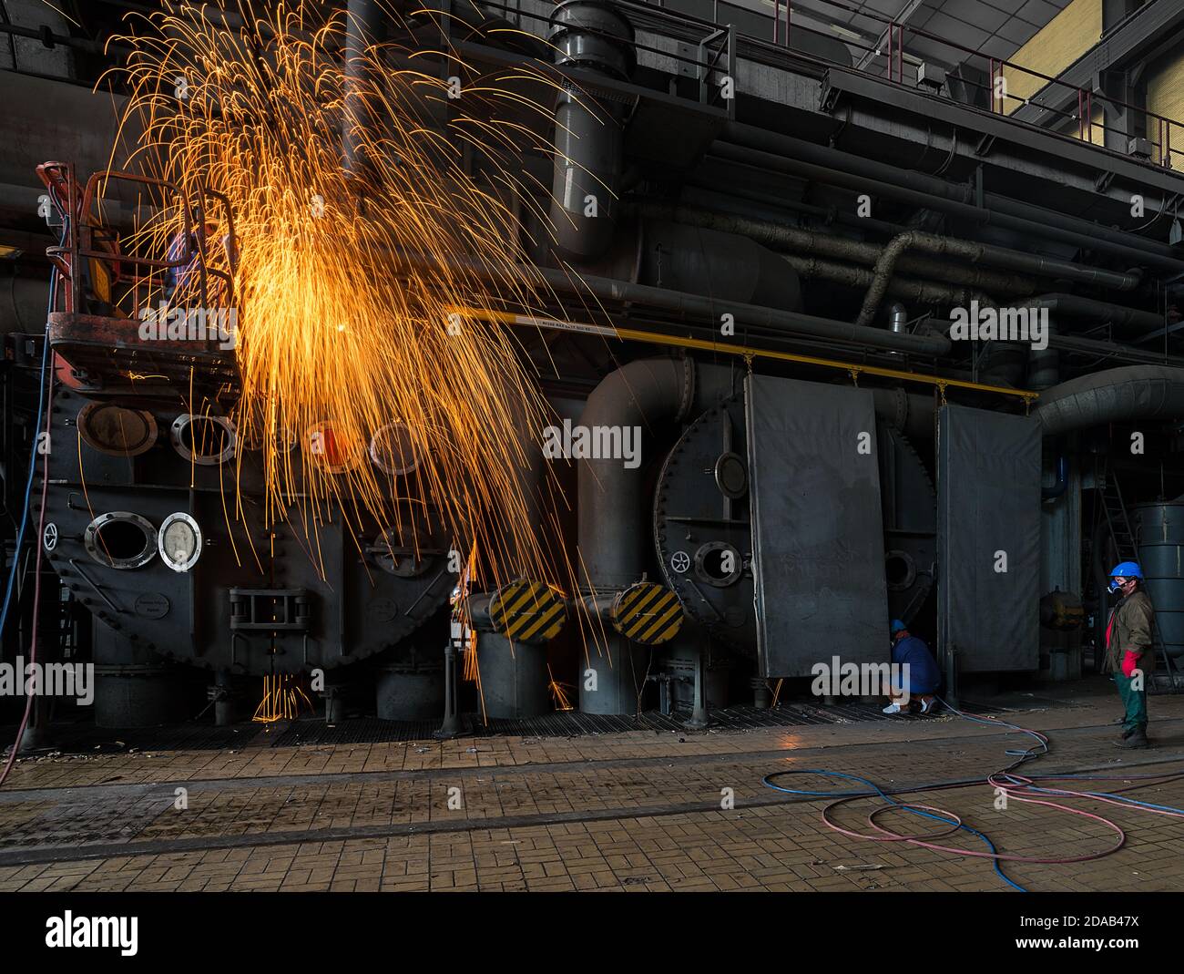 Worker welding the steel part by manual Stock Photo