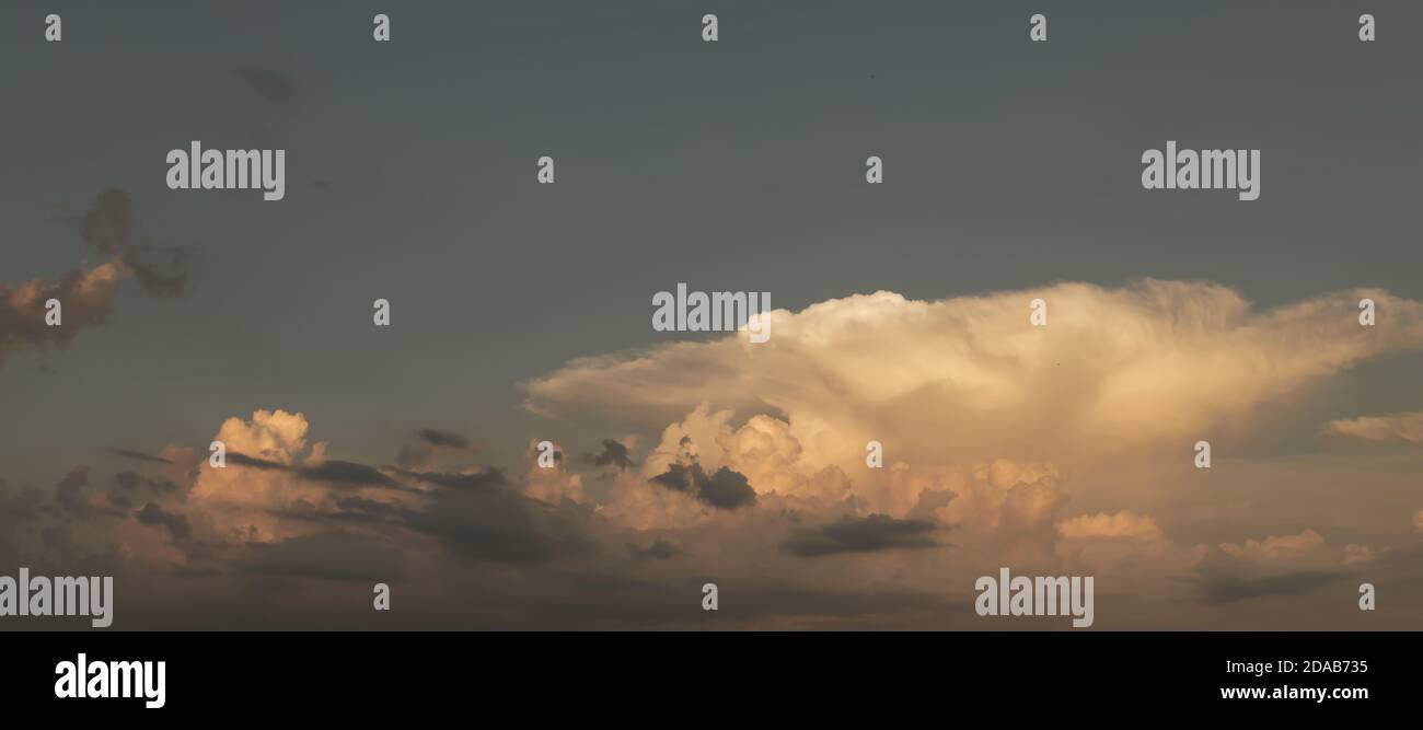 Sunset and clouds background. Sunset sky with fluffy clouds. Dramatic ...