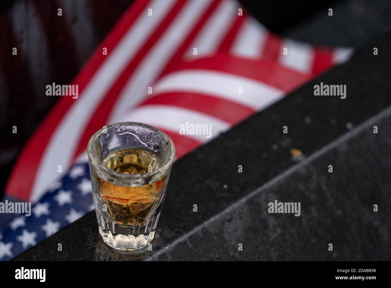 Washington, United States. 11th Nov, 2020. A shot glass filled with Jack Daniels is left at the site of Staff Sergeant Barney Barnhart by his good friend Jack Cowling, a Marine Corp veteran, HMM 364, at the Vietnam Memorial on Veterans Day in Washington, DC on Wednesday, November 11, 2020. Cowling does a shot of Jack Daniels and leaves another shot for his friend at the site every year. Veterans Day is a federal holiday in the United States observed annually on November 11, for honoring military veterans who have served in the United States Armed Forces. Photo by Ken Cedeno/UPI Stock Photo