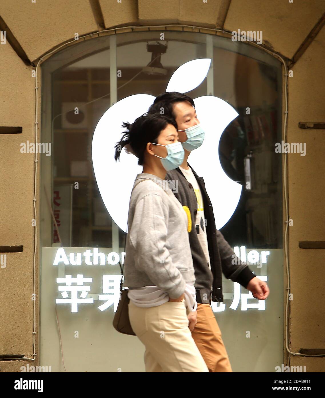 People walk past an Apple store in Beijing on Wednesday, November 11, 2020.  Apple has revealed it earned $7.9 billion in sales in China, down considerably from last year's $11.1 billion - about a 30% drop in the 4th quarter.  However, Apple's Tim Cook said it still exceeded Apple's expectations.       Photo by Stephen Shaver/UPI Stock Photo