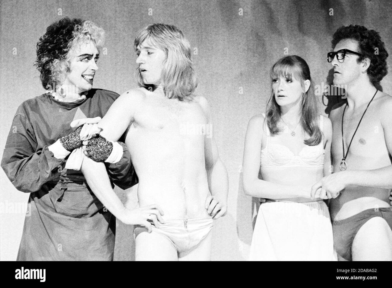 l-r: Tim Curry (Frank-n-furter), Rayner Bourton (Rocky Horror), Belinda Sinclair (Janet Weiss), Christopher Malcolm (Brad Majors) in THE ROCKY HORROR SHOW at the Chelsea Classic Cinema, London SW3 14/08/1973  transfer from the the Theatre Upstairs, Royal Court Theatre  book, music & lyrics by Richard O'Brien  set design: Brian Thomson  costumes: Sue Blane  lighting: Gerry Jenkinson  director: Jim Sharman Stock Photo