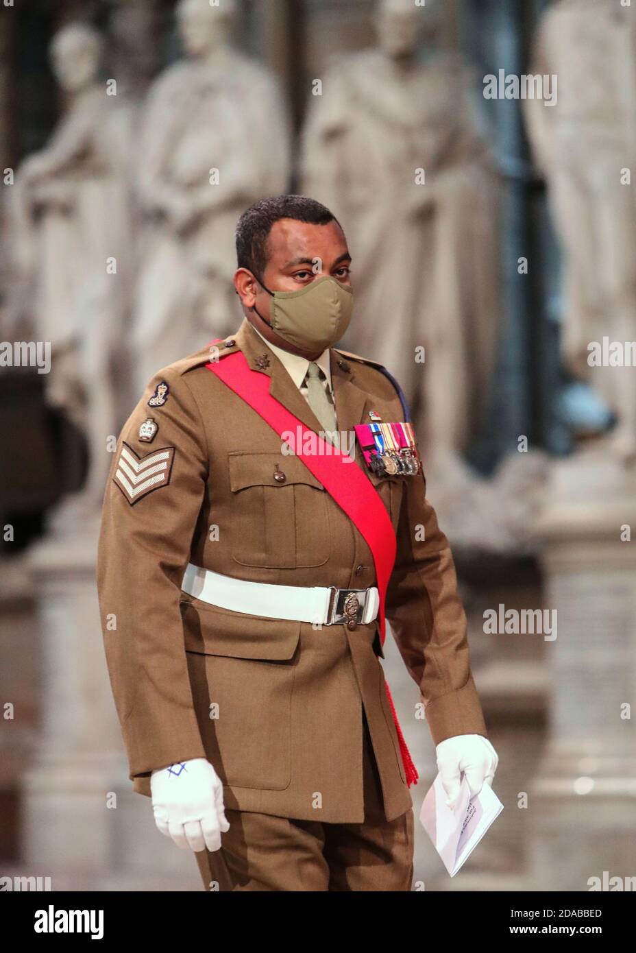 Colour Sergeant Johnson Beharry VC arrives at the High Altar during a service to mark Armistice Day and the centenary of the burial of the unknown warrior. Stock Photo