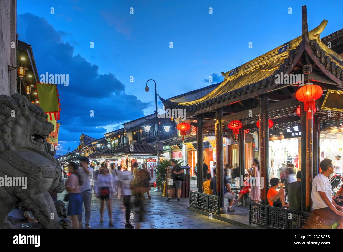 Night scene along historical Hefang Street in Hangzhou, China featuring the entrace to Hu Qing Yu Tang, a famous herbal chinese medicine. Stock Photo