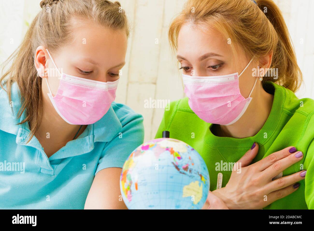 Girl hugging globe hi-res stock photography and images - Alamy