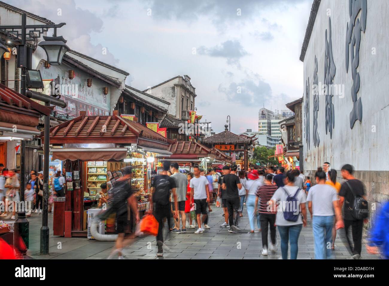 Hangzhou, China - August 3, 2019 - Evening scene along the historical Hefang Street in Hangzhou, China, with many chinese medicine and souvenirs shops Stock Photo