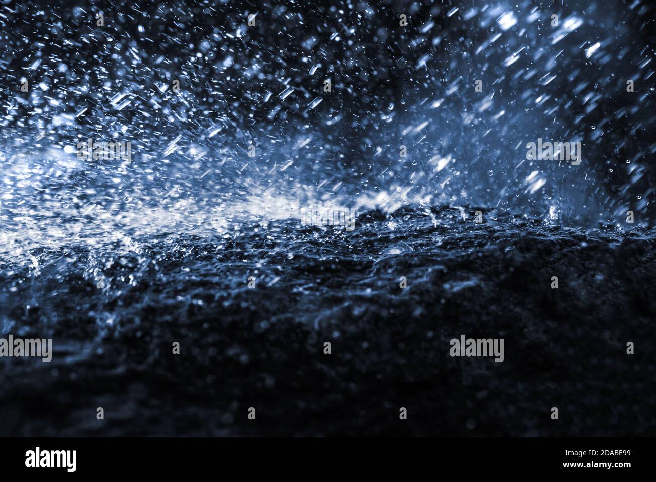 Whitestone Raining Wet stone in the rain. Rain water drop falling to the stone. Water is ...