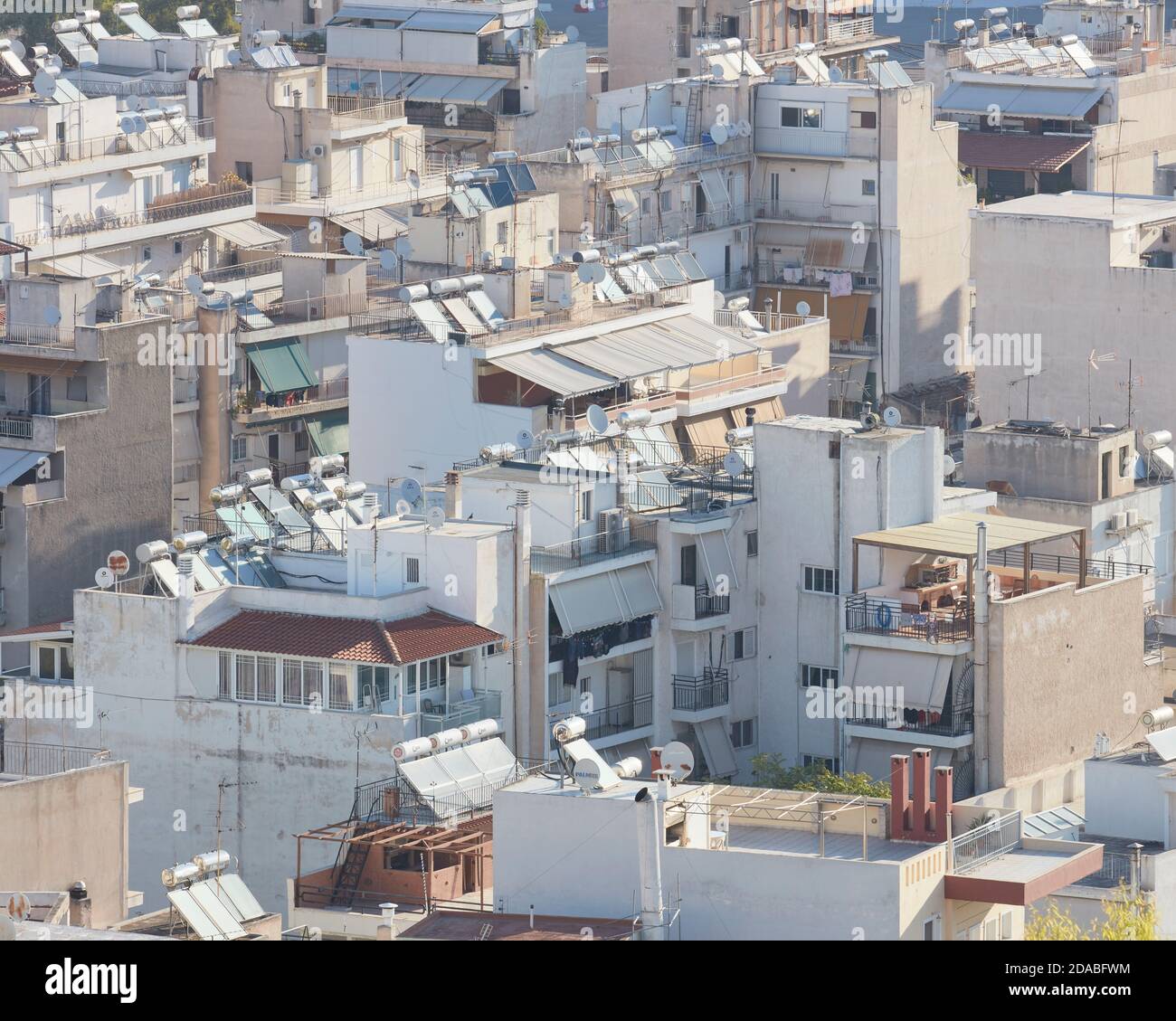 Solar power water heaters on roofs in Athens Stock Photo
