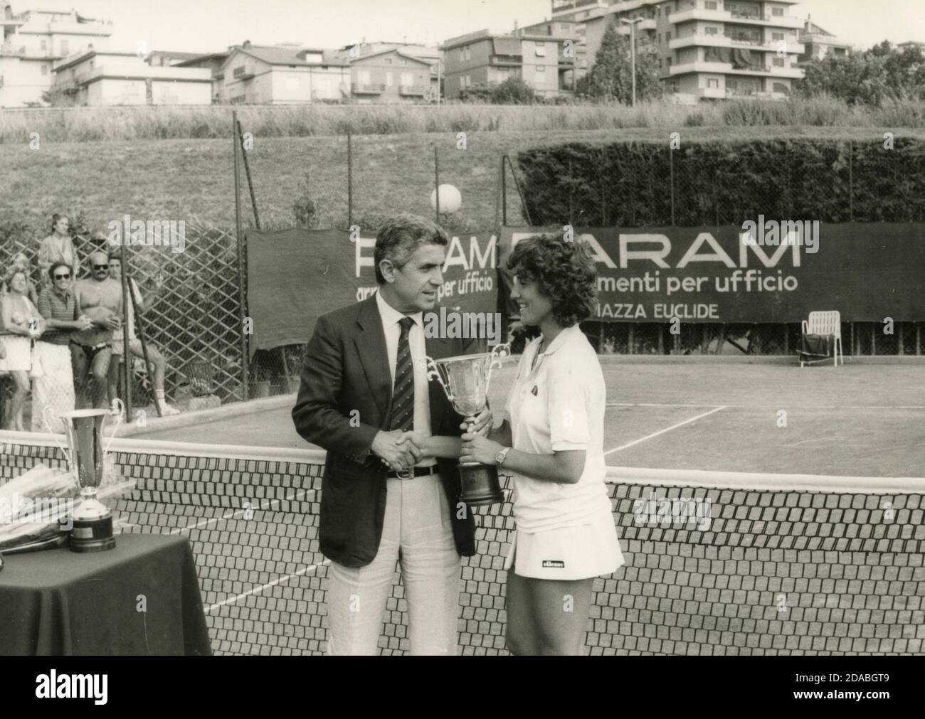 Unidentified Italian tennis player receiving a prize, Italy 1980s Stock Photo