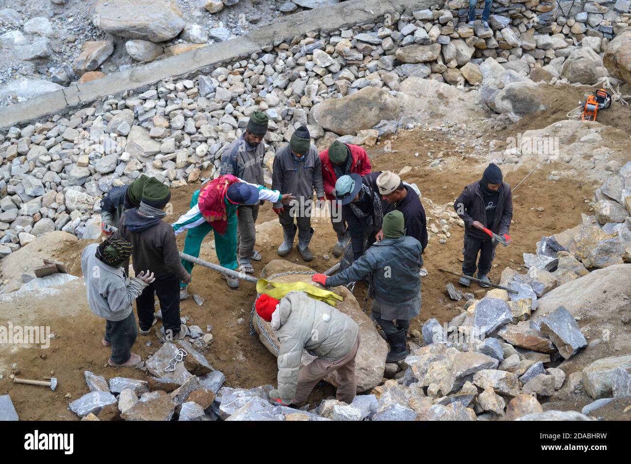 Rudarprayag, Uttarakhand, India, April 26 2014, Labor working for Kedarnath reconstruction after disaster. Portions of the Himalayan shrine in Uttarakhand were damaged in flash floods in 2013, after which the reconstruction work start.  Stock Photo