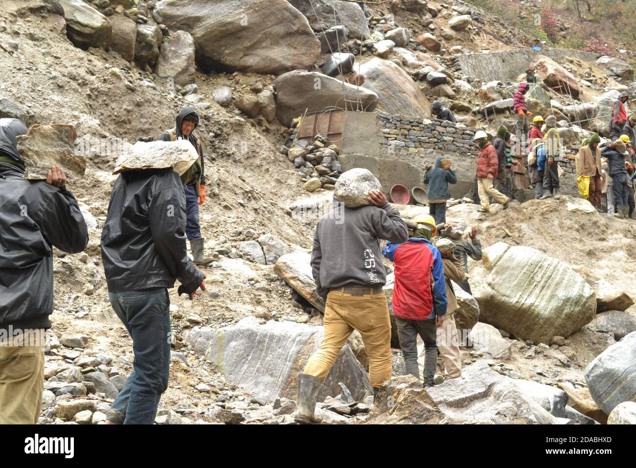 Rudarprayag, Uttarakhand, India, April 26 2014, Labor working for Kedarnath reconstruction after disaster. Portions of the Himalayan shrine in Uttarakhand were damaged in flash floods in 2013, after which the reconstruction work start.  Stock Photo