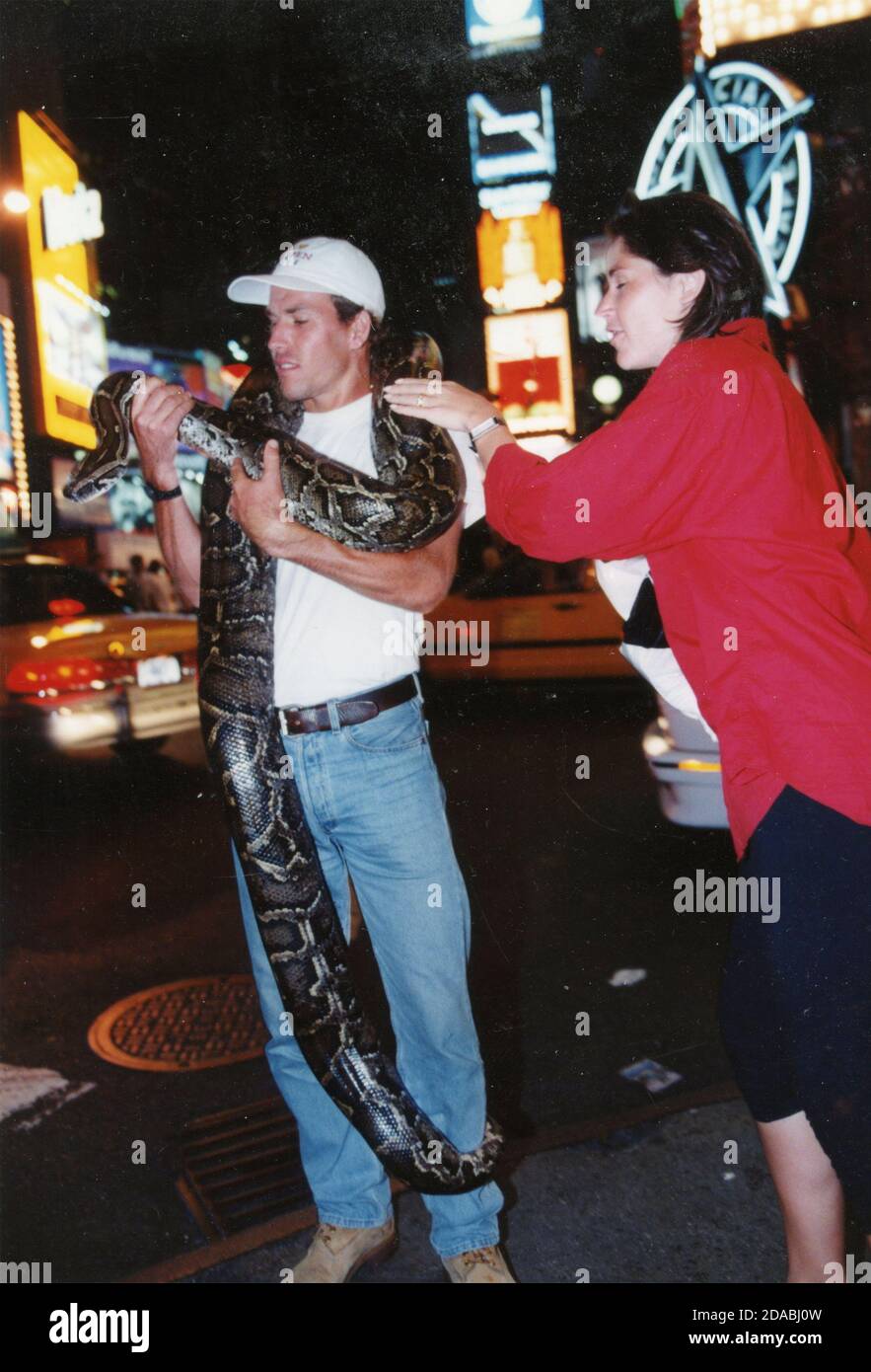 French tennis player Stephane Huet holding a 160 pounds snake on Broadway, NY, USA 1998 Stock Photo