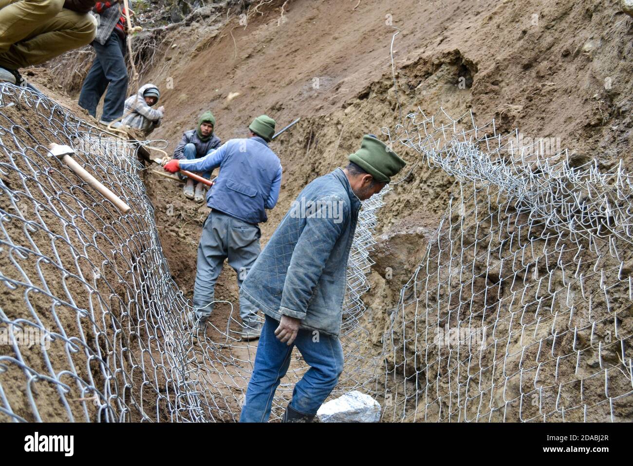 Rudarprayag, Uttarakhand, India, April 26 2014, Labor working for Kedarnath reconstruction after disaster. Portions of the Himalayan shrine in Uttarakhand were damaged in flash floods in 2013, after which the reconstruction work start.  Stock Photo