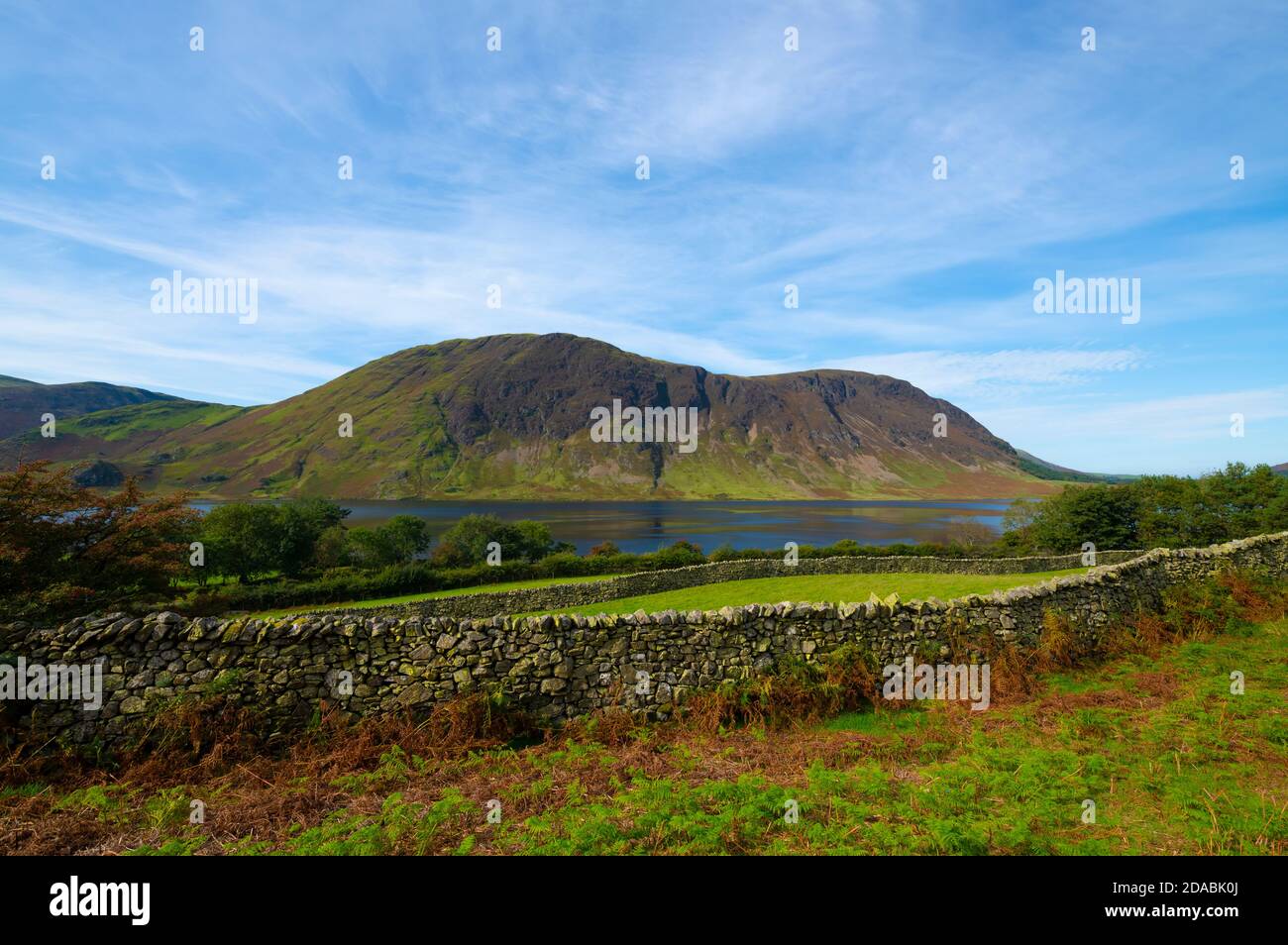 View over dry stone walls to Mellbreak and Crummock Water from Rannerdale Fell Lake District Cumbria England UK United Kingdom GB Great Britain Stock Photo