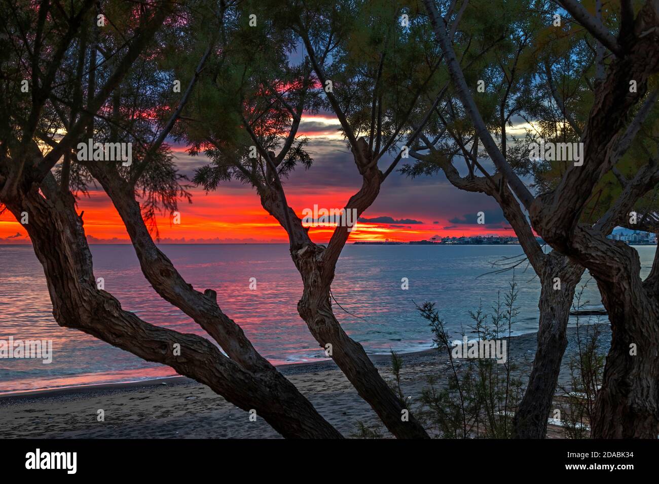 Sunset at Ierapetra town (Lassithi, Crete, Greece) at the edge of two seasons, end of summer, beginning of autumn. Stock Photo